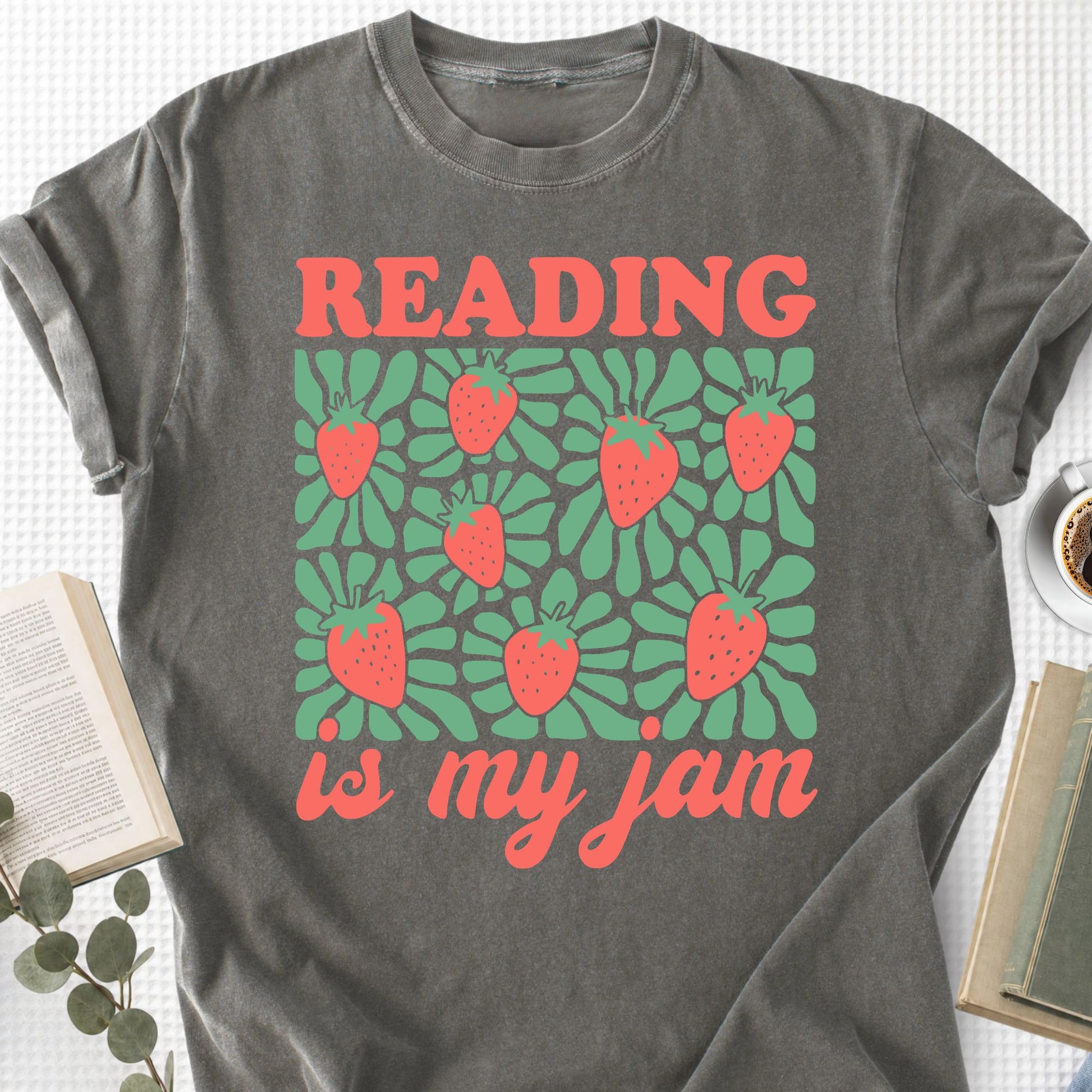 Gray t-shirt with 'Reading is my jam' design featuring strawberries on a textured surface.