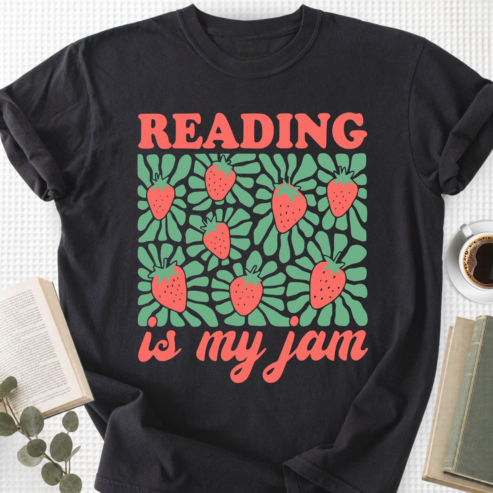 Black t-shirt with 'Reading is my jam' design featuring strawberries on a white background.