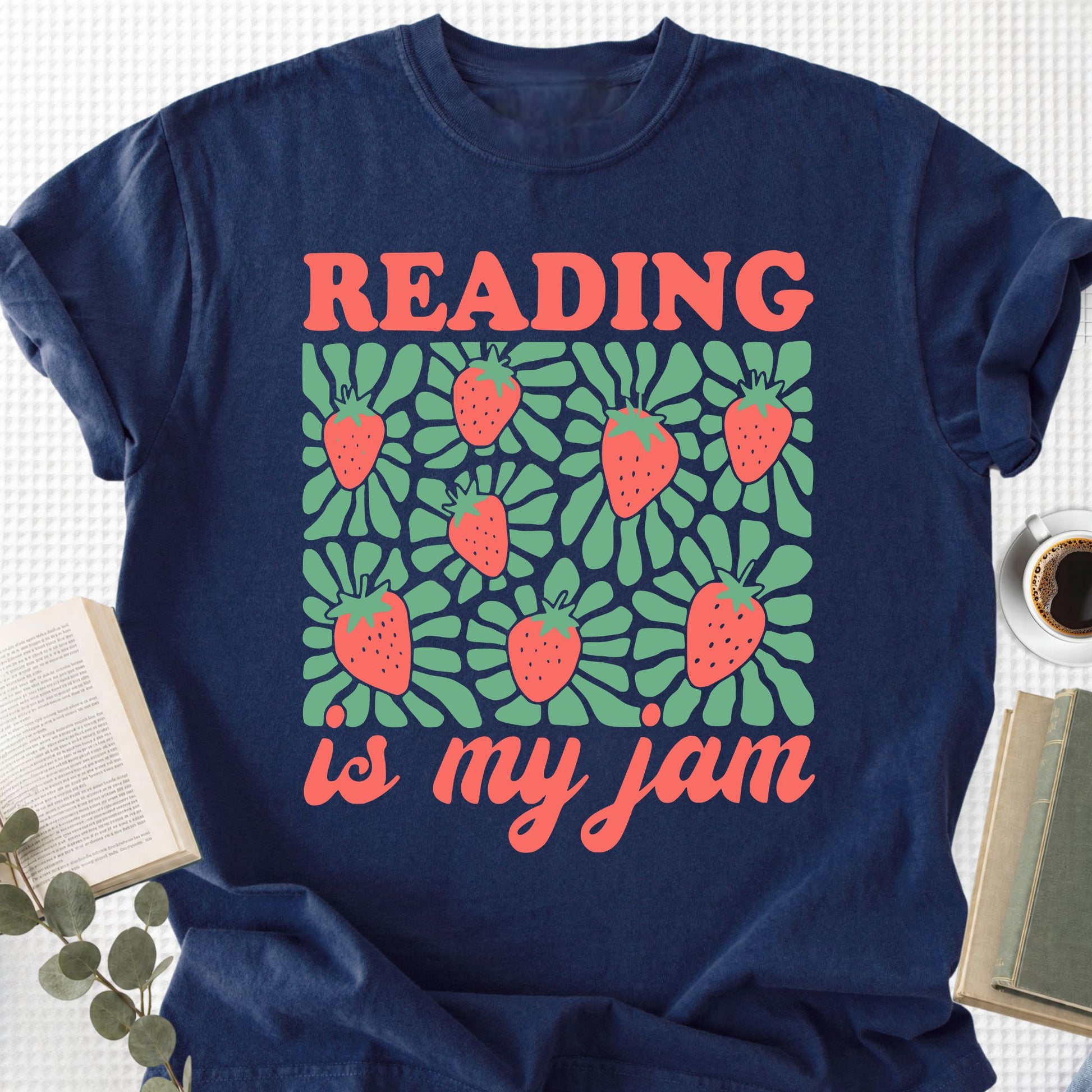 Navy blue t-shirt with 'Reading is my jam' design featuring strawberries on a white background.